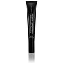A black tube from the Revision Skincare Glow Essentials Gift Set (RSC) stands upright on a white background, featuring a white-on-black label. The 0.33 oz (9.4 g) tube hydrates and rejuvenates your lips.