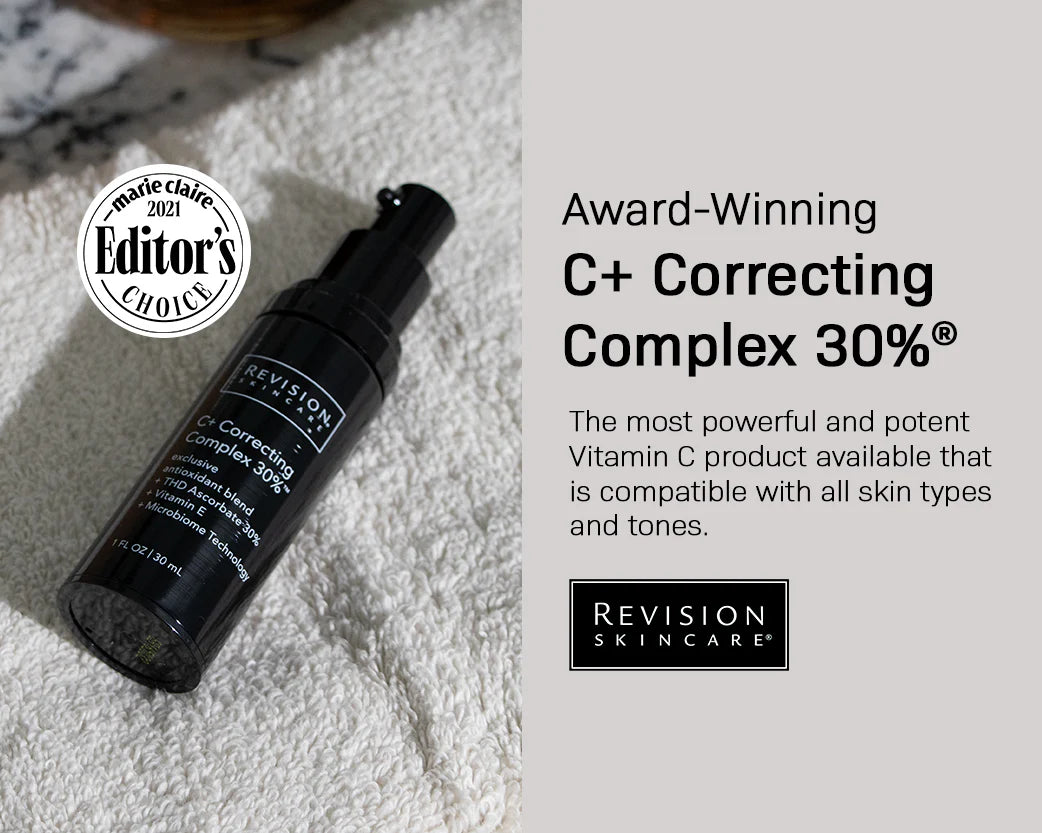 A black bottle of Revision Skincare C+ Correcting Complex 30% sits on a textured white surface beside a rug, with text highlighting it as an award-winning Vitamin C skincare product suitable for all skin types.