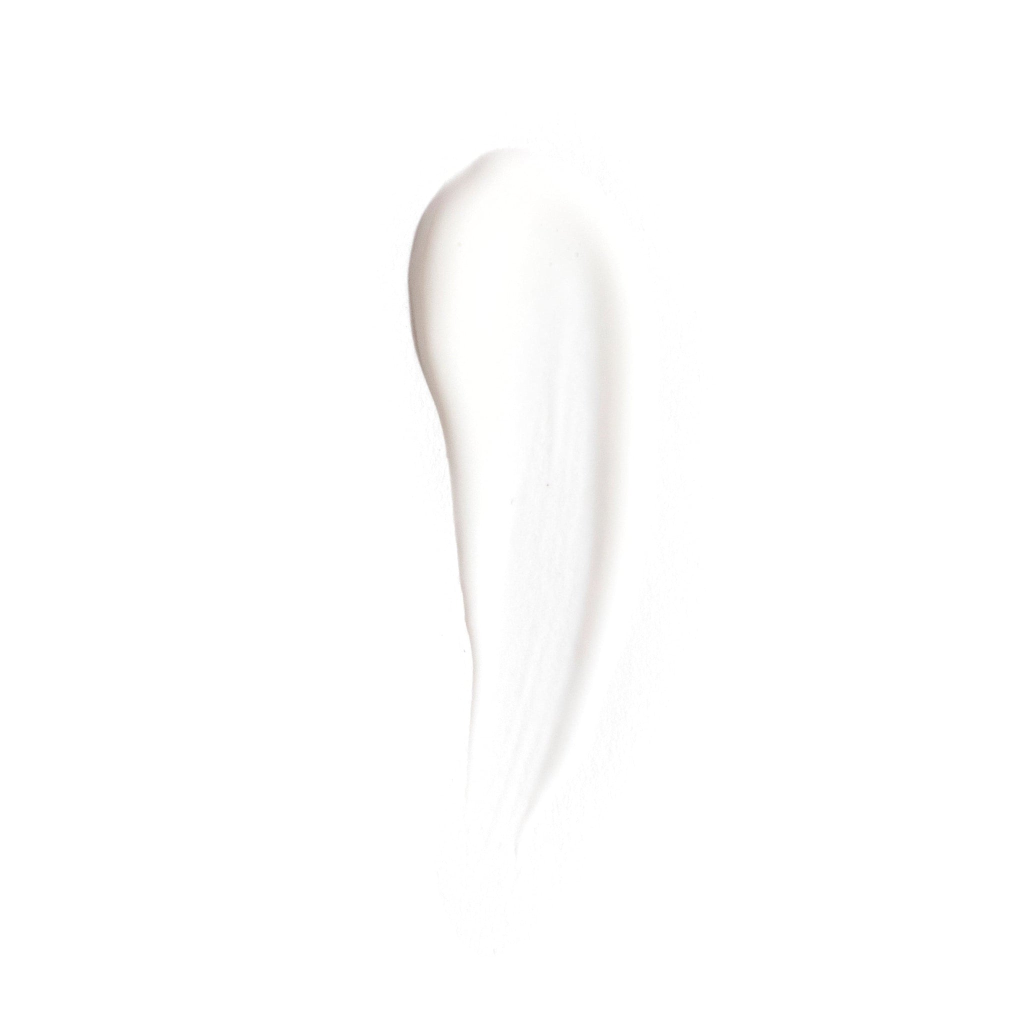 A smooth, white creamy smear resembling the texture of Revision Skincare’s C+ Correcting Complex 30%®, a skincare product infused with Vitamin C for skin brightening, displayed on a white background.