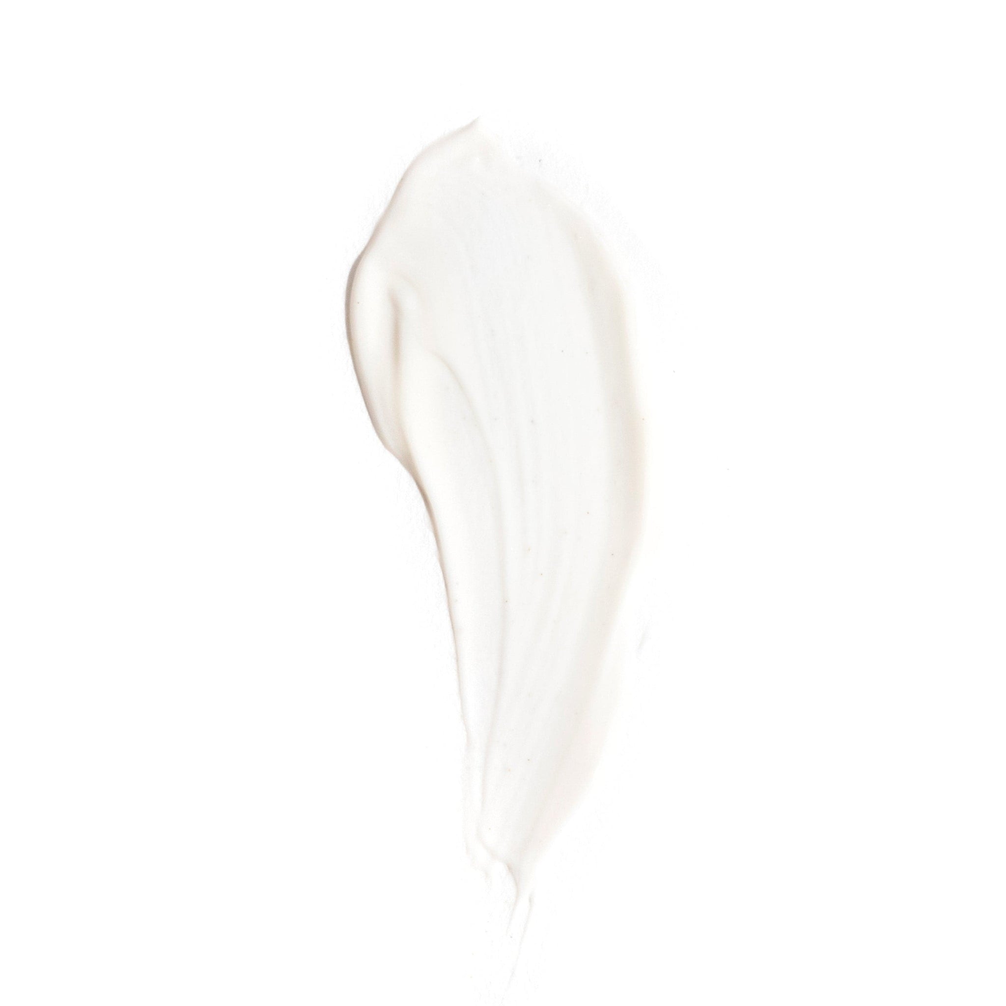 A creamy white smear of Revision Skincare D·E·J Eye Cream® on a plain white background, featuring a smooth, slightly glossy texture—ideal for targeting eyelid drooping and other visible signs of skin aging.