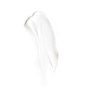 A smear of creamy white lotion on a plain background highlights the smooth texture of Revision Skincare D·E·J Face Cream®, ideal for visually representing its skin-renewing, texture-improving benefits.