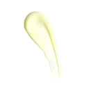 A creamy, light yellow smear of Revision Skincare Vitamin K Serum 0.5 fl oz, enriched with Arnica Montana Extract, is spread smoothly on a white background.