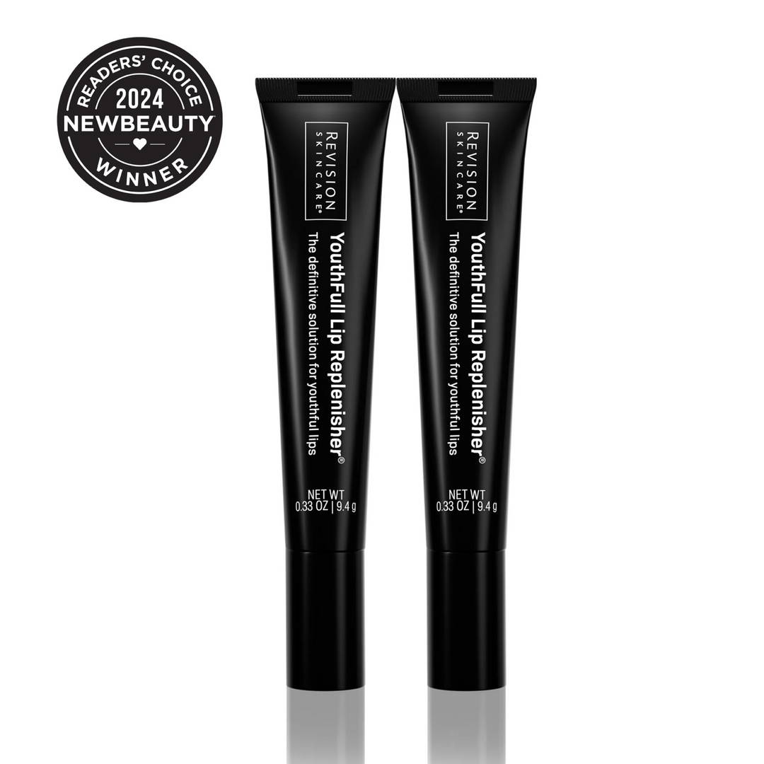 Two black tubes of Revision Skincare YouthFull Lip Replenisher® 2-Pack stand upright, each containing 9.4g (0.33 oz). A badge on the top left says 2024 NewBeauty Readers Choice Winner. Features hyaluronic acid for youthful volume.