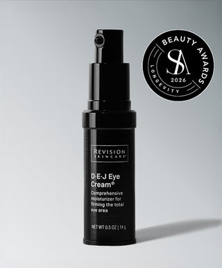 A black bottle of D·E·J Eye Cream® by Revision Skincare, a firming eye treatment for crow’s feet, is shown beside a round 2026 Beauty Awards Longevity seal on a light gray background.