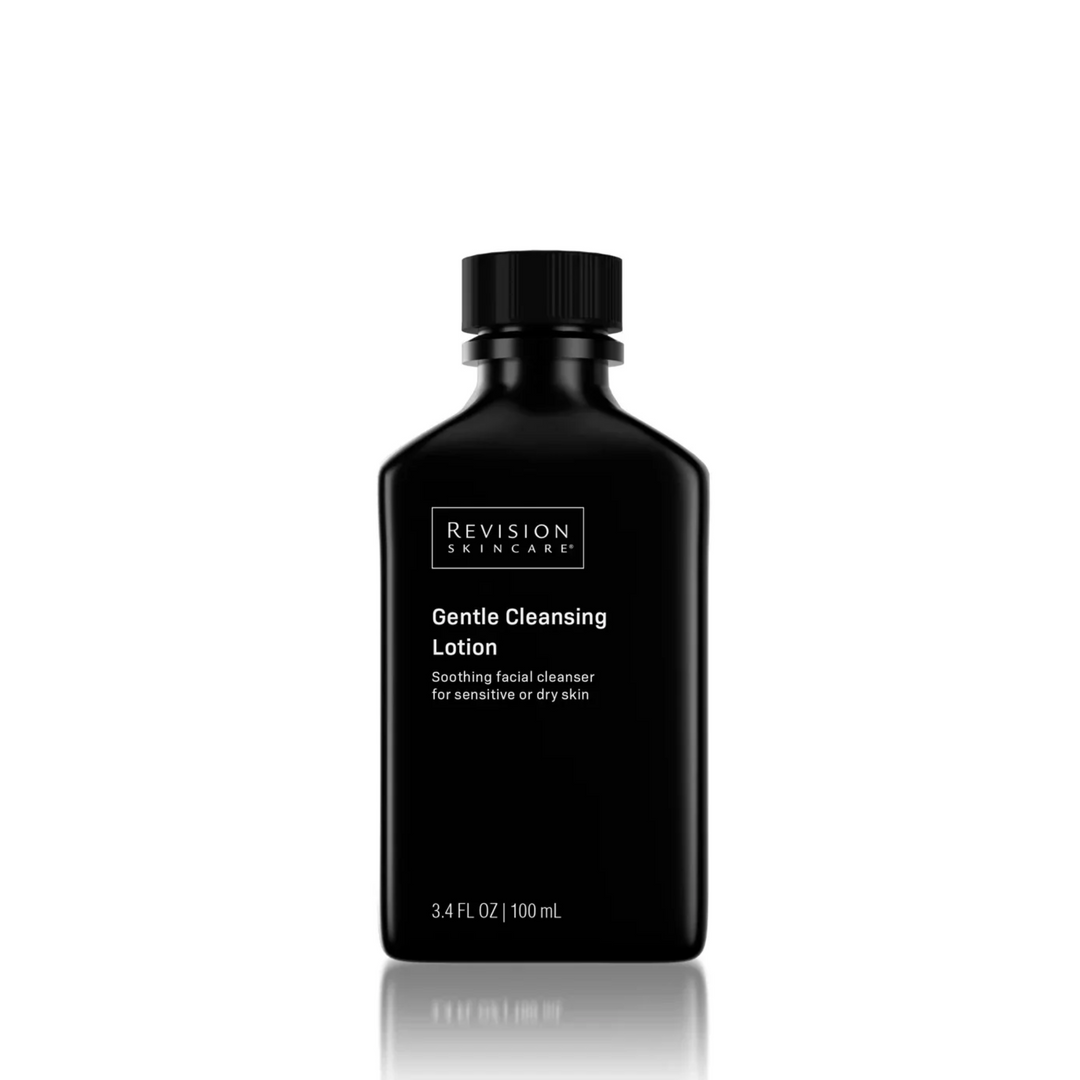 A black bottle of Revision Skincare Travel Size Gentle Cleansing Lotion, 3.4 fl oz, with a black cap and white text, fragrance free and suitable for dry or sensitive skin, displayed on a white background.