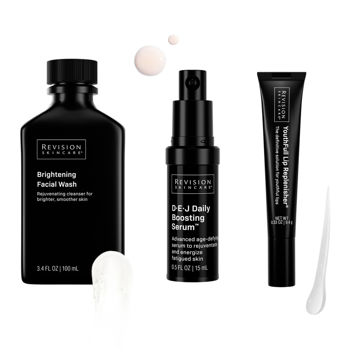 The Glow Essentials Gift Set by Revision Skincare features three products in sleek black packaging with swatches, designed to brighten and rejuvenate your skin.
