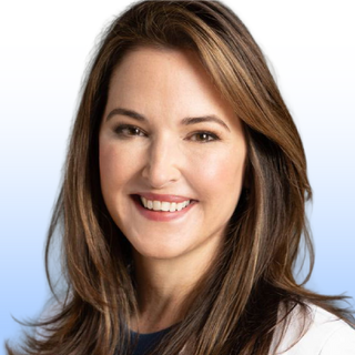 A woman with long brown hair and fair skin is smiling at the camera. She is wearing a white top and is set against a light blue and white gradient background.