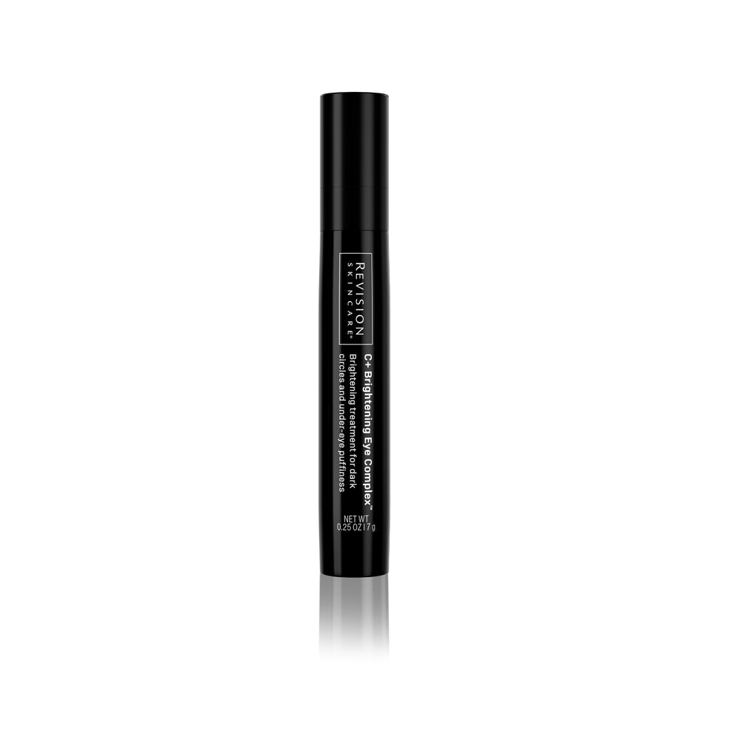 A black tube of Revision Skincare Travel Size C+ Brightening Eye Complex™ 0.25 oz with white text stands upright on a white background—formulated with Vitamin C to target dark circles and under-eye puffiness.