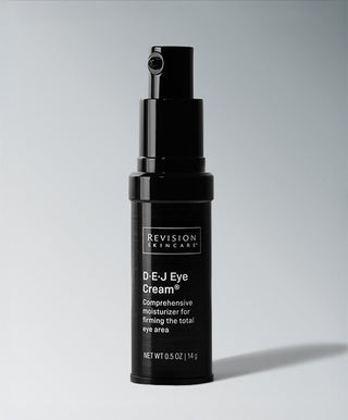 A black pump bottle of Revision Skincare D·E·J Eye Cream® stands upright on a light gray background, highlighting this comprehensive eye moisturizer designed for under-eye firming and crow’s feet treatment.