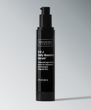 A black pump bottle labeled Revision Skincare D·E·J Daily Boosting Serum®, an advanced serum that rejuvenates tired skin and boosts cellular energy to improve firmness. 2 fl oz (60 ml).