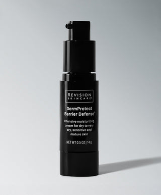 A black bottle of Revision Skincare DermProtect Barrier Defense™ cream with a pump dispenser stands upright on a light gray background. The label highlights hydration and barrier defense for sensitive and mature skin.