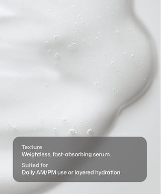 A close-up of a white, creamy liquid with small bubbles and smooth texture. Text: “Texture: Weightless, fast-absorbing HA HydraSerum+™ by Revision Skincare. For daily AM/PM use or layered hydration.”.