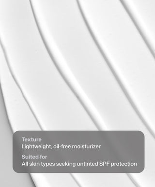 Smooth, white Intellishade® Clear by Revision Skincare is spread in even, diagonal lines. Overlay text: Texture: Lightweight, oil-free SPF 50 moisturizer. Suited for all skin types seeking untinted, age-defying sun protection.