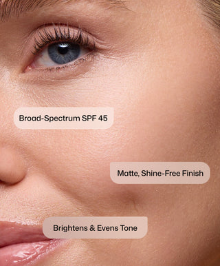 A close-up of smooth, even skin with labels: Intellishade® Matte SPF 45 moisturizer by Revision Skincare, Matte Shine-Free Finish, and Brightens & Evens Tone.