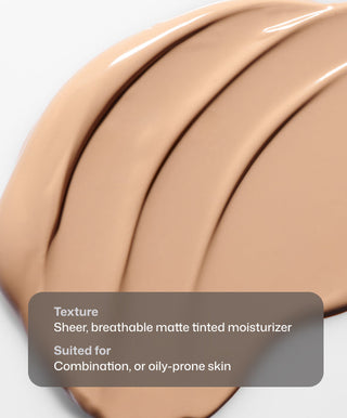 A close-up of Revision Skincare Intellishade® Matte’s smooth, beige matte finish swatched on white, with text overlay: Sheer, breathable matte tinted moisturizer for combination or oily-prone skin.