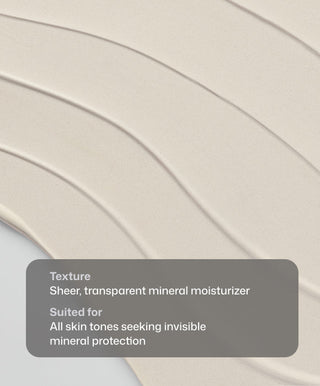 Beige, creamy Intellishade® TruPhysical Clear by Revision Skincare is spread smoothly in waves. A gray box highlights its lightweight feel and suitability for all skin tones needing invisible, all-mineral SPF 50 protection.