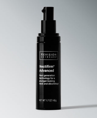 A black bottle of Revision Skincare Nectifirm® Advanced with a pump stands upright on a gray background, featuring its anti-aging neck treatment with Microbiome technology for a younger-looking neck and décolletage.