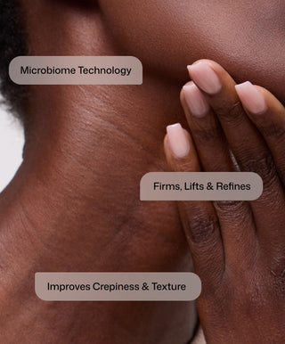 Close-up of a person touching their neck with manicured nails. Text: Revision Skincare Nectifirm® Advanced uses microbiome technology to firm, lift, refine, and improve neck crepiness and texture for anti-aging benefits.