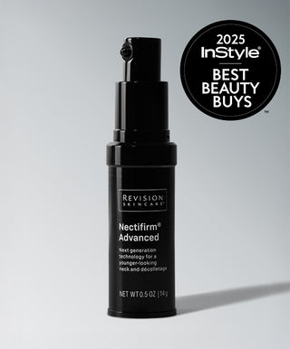 A black bottle of Revision Skincare Nectifirm® Advanced stands upright on a gray surface. A circular badge in the top right reads "2025 InStyle Best Beauty Buys," spotlighting its anti-aging Microbiome technology.