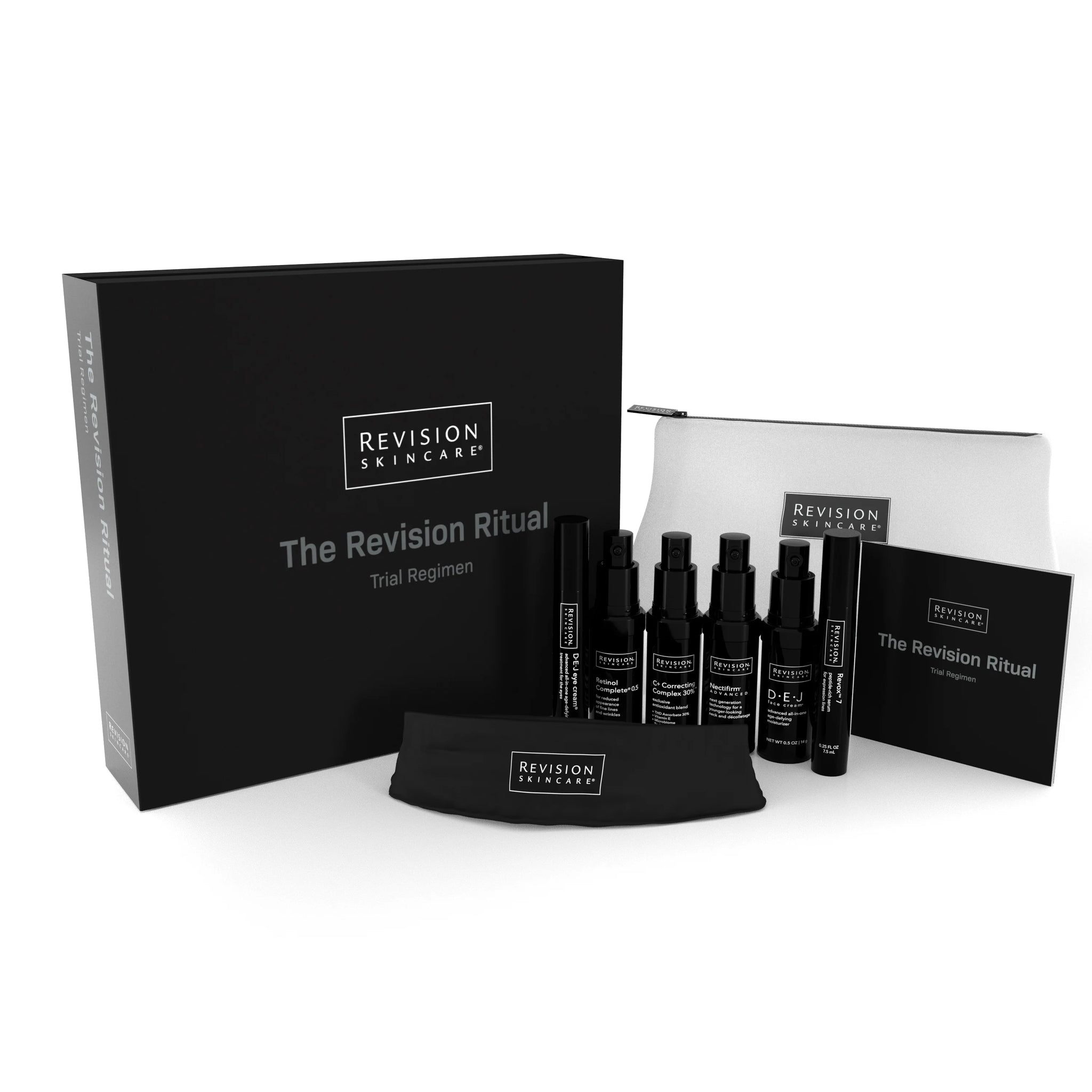 A set of Revision Skincare products, including bottles, a pouch, a headband, and a booklet, displayed next to a large black box labeled The Revision Ritual Trial Regimen.