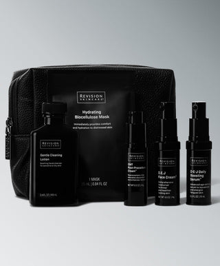 The Revision Skincare Procedure Prep & Recover Regimen—including bottles, lotion, and hydrating mask—ideal for post-procedure care, is arranged before a black textured travel bag on a gradient gray background.