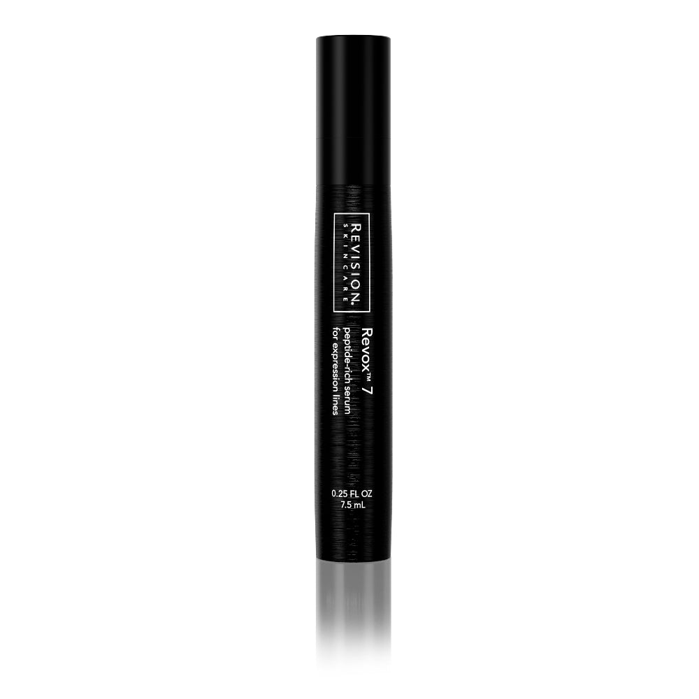 A black cylindrical tube labeled Revision Skincare Travel Size Revox™ 7, 0.25 fl oz, containing a peptide-rich formula for expression lines, is shown upright on a white background.