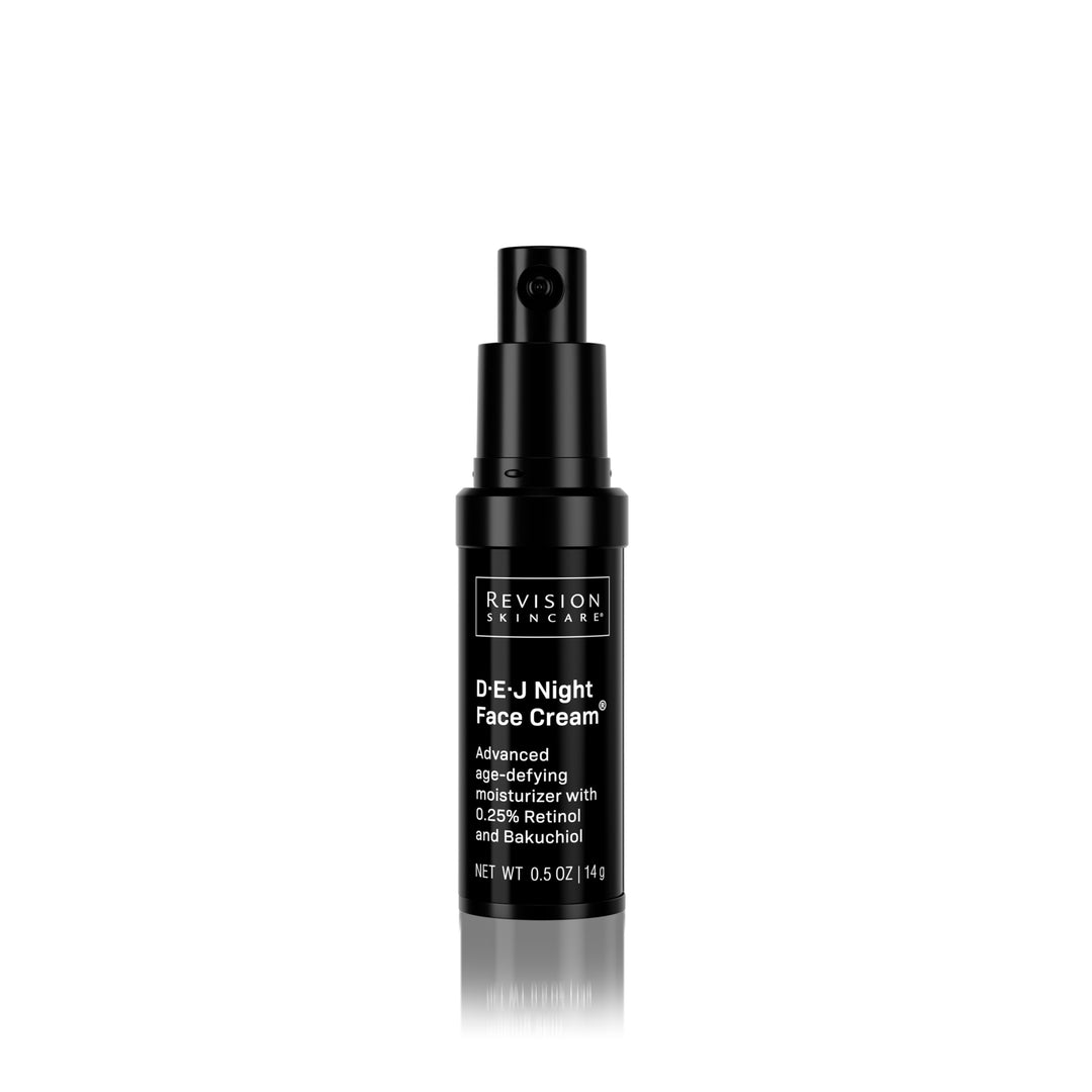 A 0.5 oz travel-size bottle of Revision Skincare D·E·J Night Cream® with a pump top, labeled as an advanced age-defying night moisturizer containing retinol and bakuchiol.