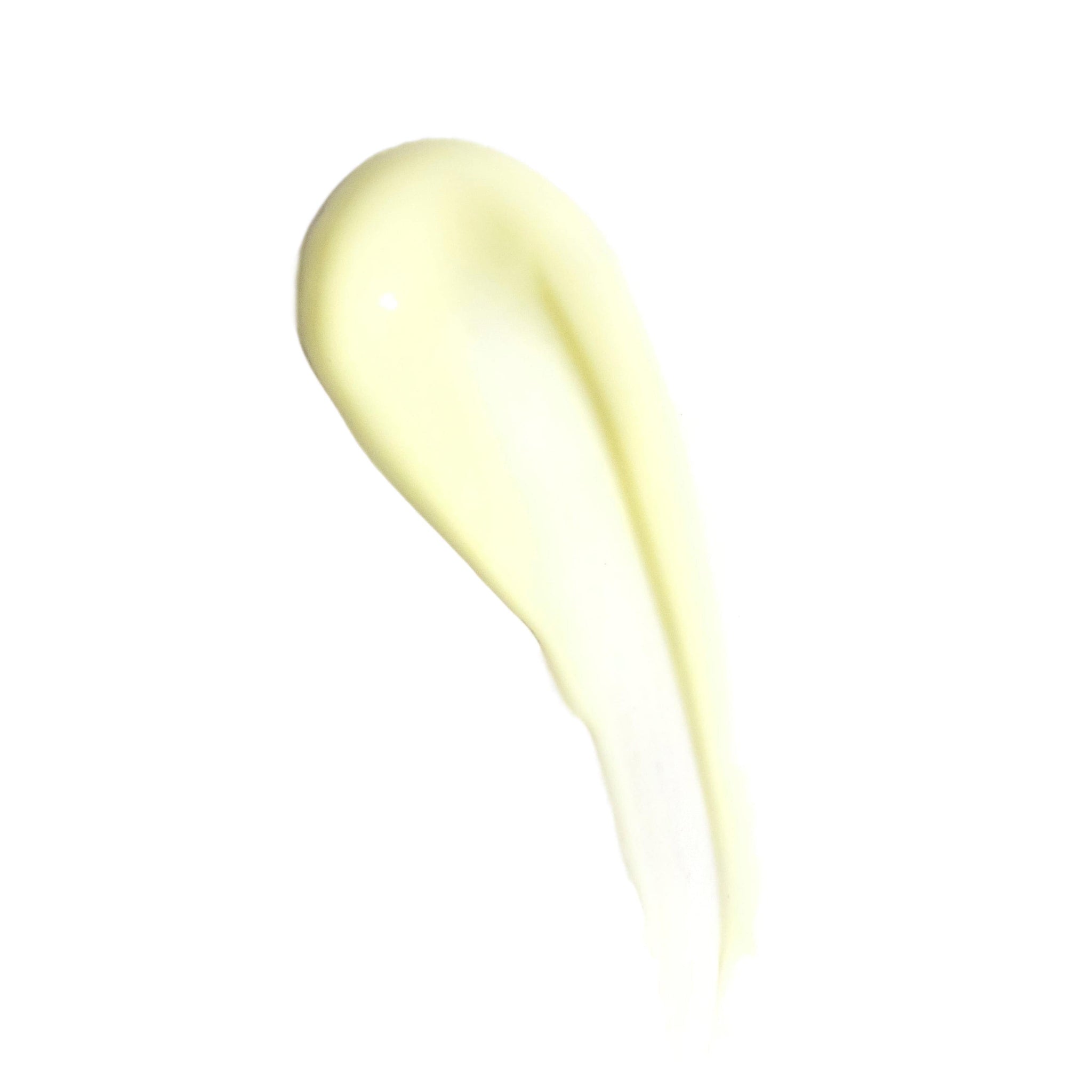 A creamy, light yellow smear of Revision Skincare Vitamin K Serum 0.5 fl oz, enriched with Arnica Montana Extract, is spread smoothly on a white background.