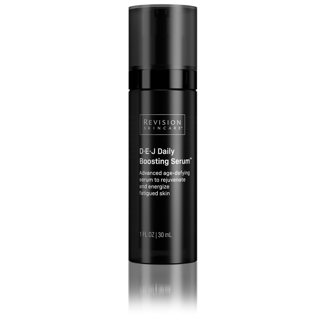 A black cylindrical bottle of Revision Skincare D·E·J Daily Boosting Serum® features a pump dispenser and white text describing this advanced serum that energizes, rejuvenates, and enhances skin firmness.