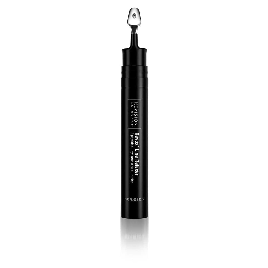 A black tube of Revision Skincare Revox™ Line Relaxer with a metal applicator tip stands upright on a white background, formulated to target fine lines and wrinkles for visible improvement in skin texture.